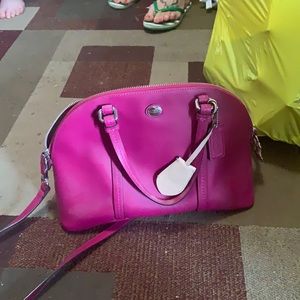 Medium Magenta Coach purse.